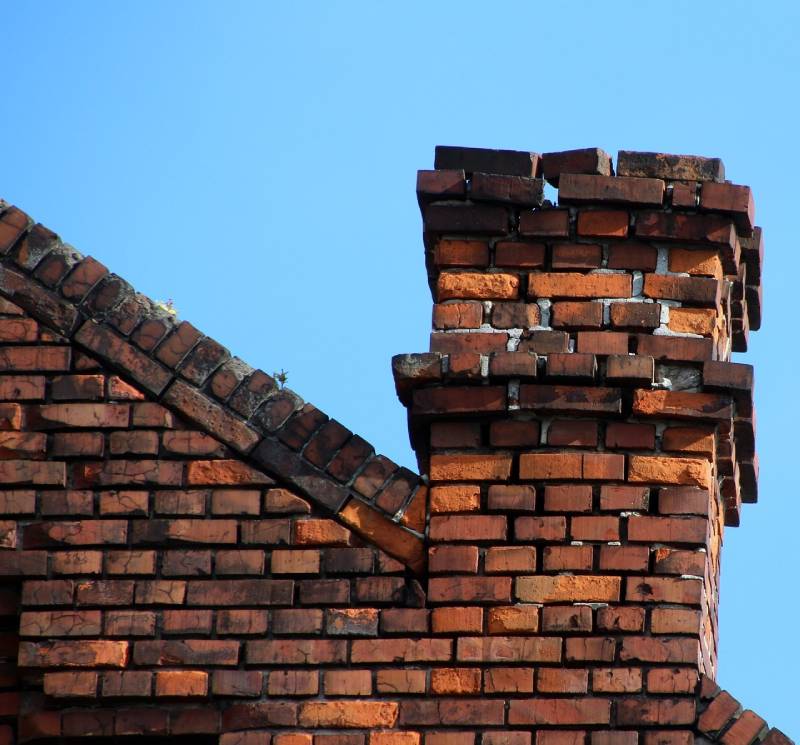 Signs Your Crofton Home Needs a Chimney Inspection Damaged chimney on an Crofton home showing cracks and missing mortar